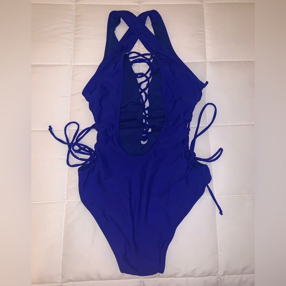 Royal Blue one piece side & front tie adjustable swimsuit. Size 4